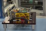 One of the two MarCO (Mars Cube One) CubeSat spacecraft, with its insides displayed, is seen at NASA's Jet Propulsion Laboratory, Pasadena, California.