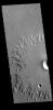 This image from NASA's 2001 Mars Odyssey spacecraft shows part of an unnamed crater in Amazonis Planitia. The radial nature of the emplaced ejecta can be seen at the edge of the ejecta.