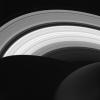 NASA's Cassini spacecraft looks down at the rings of Saturn from above the planet's nightside. The darkened globe of Saturn is seen here at lower right, along with the shadow it casts across the rings.