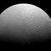 Enceladus is a world divided. To the north, NASA's Cassini spacecraft see copious amounts of craters and evidence of the many impacts the moon has suffered in its history. However, to the south we see a smoother body with wrinkles due to geologic activity