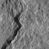 NASA's Dawn spacecraft sees Occator Crater, home of the brightest area on Ceres, also has an intriguing rim. The jagged slopes of this basin, and linear features on its floor, contrast with the relatively smooth terrain around it.