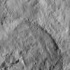 This picture captured by NASA's Dawn spacecraft shows a crater that lies just north of Occator Crater, home of the brightest spots on Ceres. The northern rim of Occator, not visible here, is overprinted on the southern rim this crater.