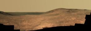 'Marathon Valley' on Mars opens northeastward to a view across the floor of Endeavour Crater in this scene from the panoramic camera (Pancam) of NASA's Mars Exploration Rover Opportunity.