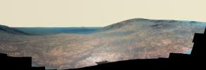 'Marathon Valley' on Mars opens northeastward to a view across the floor of Endeavour Crater in this enhanced color scene from the panoramic camera (Pancam) of NASA's Mars Exploration Rover Opportunity.