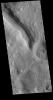 This image captured by NASA's 2001 Mars Odyssey spacecraft shows a short section of channel between two craters in Terra Sabaea.