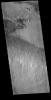 In the bottom half of this image captured by NASA's 2001 Mars Odyssey spacecraft is a line of small volcanic vents.