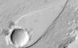 This image from NASA's Mars Reconnaissance Orbiter shows a large field of sand dunes on Kaiser Crater. They are partially free of seasonal ice, with the contrast making it easy to see the ripples.