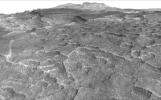 This vertically exaggerated view shows scalloped depressions in Mars' Utopia Planitia region, prompting the use of ground-penetrating radar aboard NASA's Mars Reconnaissance Orbiter to check for underground ice.