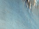 This picture of the rim of Eos Chasma in Valles Marineris, captured by NASA's Mars Reconnaissance Orbiter, shows active erosion of the Martian surface.