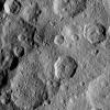 This image shows a portion of the northern hemisphere of Ceres, as seen by NASA's Dawn spacecraft. Cozobi Crater is the sharply defined impact feature at top left. At far right is Victa Crater. Abellio Crater is sharply defined crater with a central peak.