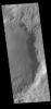 This image captured by NASA's 2001 Mars Odyssey spacecraft shows the sunrise shadow of the crater rim on the crater floor.