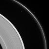 The thin sliver of Saturn's moon Prometheus lurks near ghostly structures in Saturn's narrow F ring in this view from NASA's Cassini spacecraft. Many of the narrow ring's faint and wispy features result from its gravitational interactions with Prometheus.