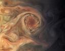 This image, taken by the JunoCam imager on NASA's Juno spacecraft, highlights a swirling storm just south of one of the white oval storms on Jupiter.
