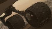 Two of the raised treads, called grousers, on the left middle wheel of NASA's Curiosity Mars rover broke during the first quarter of 2017, seen is the partially detached at the top of the wheel in this image from the MAHLI camera on the rover's arm.