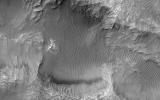 This image from NASA's Mars Reconnaissance Orbiter shows an elongated depression from three merged craters.