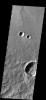 Shadows are just right to form googly eyes in this image captured by NASA's 2001 Mars Odyssey spacecraft.