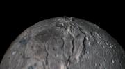 The flight over Charon begins high over the hemisphere NASA's New Horizons saw on its closest approach, then descends over the deep, wide canyon of Serenity Chasma.