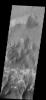 This image from NASA's 2001 Mars Odyssey spacecraft is located in central Coprates Chasma. The brighter materials at the bottom of the image are layered deposits. It is unknown how deep these canyon deposits were when they formed.