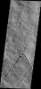 This image from NASA's 2001 Mars Odyssey spacecraft shows part of the southeastern flank of Pavonis Mons. Pavonis Mons is one of the three aligned Tharsis Volcanoes.