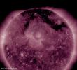 NASA's Solar Dynamics Observatory observed a dark structure, shaped kind of like the Pi symbol, spreading across much of the top of the sun this week (Oct. 12-13, 2017).