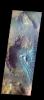 This is a false color image of Rabe Crater from NASA's 2001 Mars Odyssey spacecraft. In this combination of filters 'blue' typically means basaltic sand. Rabe Crater is 108 km (67 miles) across. Craters of similar size often have flat floors.