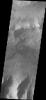 This image captured by NASA's 2001 Mars Odyssey spacecraft shows a section of Ius Chasma that is not dominated by landslide deposits. Geryon Montes has several visible faults, including a pair of faults that divide the uppermost ridge into two sections.