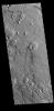 The arcuate fractures and broken up surface shown in this image from NASA's 2001 Mars Odyssey spacecraft is called Avernus Colles. This unique surface has developed on the southeast margin of Elysium Plainitia.