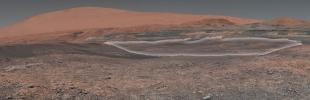This mosaic taken by NASA's Mars Curiosity rover looks uphill at Mount Sharp. Highlighted is an area in white with clay-bearing rocks that scientists are eager to explore.