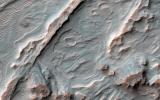 Shown in this image from NASA's Mars Reconnaissance Orbiter are alluvial fans, fan-shaped deposits emerging from regions of steep topography. Alluvial fans on Mars are thought to be ancient and record past episodes of flowing water.