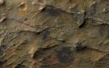 This observation from NASA's Mars Reconnaissance Orbiter shows a set of straight ridges in ancient bedrock near Nirgal Valles. The patterns indicate fractures from tectonic stresses.