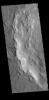 This image captured by NASA's 2001 Mars Odyssey spacecraft shows the western rim of Bamberg Crater. The complex nature of the rim is one indication of the relative youth of this crater in relation to it's surrounding.