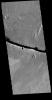 This image captured by NASA's 2001 Mars Odyssey spacecraft shows a section of Cerberus Fossae. Located southeast of the Elysium Planitia volcanic complex, the linear graben was created by tectonic forces related to the volcanic activity.