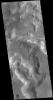 This image captured by NASA's 2001 Mars Odyssey spacecraft is located on the margin of the Nili Fossae region and Isidis Planitia.