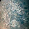 This image from NASA's Juno spacecraft captures swirling cloud belts and tumultuous vortices within Jupiter's northern hemisphere. The region seen here is somewhat chaotic and turbulent, given the various swirling cloud formations.