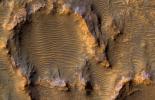 This enhanced color image from NASA's Mars Reconnaissance Orbiter shows eroded bedrock on the floor of a large ancient crater.