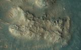 This image acquired on May 13, 2018 by NASA's Mars Reconnaissance Orbiter, shows sand dunes scouring what appears to be a highly-cratered, old lava flow in the Tempe Terra region, located in the Northern Hemisphere.