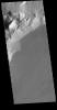 This image from NASA's Mars Odyssey shows Olympus Rupes, the large escarpment surrounding Olympus Mons. The escarpment is a cliff where there is a large elevation change over a short distance.