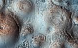 This image acquired on May 15, 2018 by NASA's Mars Reconnaissance Orbiter, shows relatively bright mounds scattered throughout darker and diverse surfaces in Chryse Planitia.
