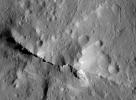 This close-up view of the central peak of the 99-mile-wide (160-kilometer-wide) Urvara impact crater on Ceres was captured by NASA's Dawn spacecraft on June 21, 2018 from an altitude of about 83 miles (134 kilometers).