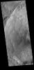This image from NASA's Mars Odyssey shows half of an unnamed crater in Noachis Terra. The complex rim and rough floor are indicative of a relatively young crater.
