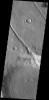 This image from NASA's Mars Odyssey shows an unnamed crater, located on the northern margin of Aonia Terra, interacting with one of the fossa, also called a graben.