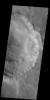 This image from NASA's Mars Odyssey shows many large gullies dissecting the rim of this unnamed crater in Aonia Terra.