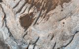 This image acquired on December 8, 2018 by NASA's Mars Reconnaissance Orbiter, shows erosion of the surface revealing several shades of light toned layers, likely sedimentary deposits.