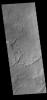 This image from NASA's Mars Odyssey shows a small part of Daedalia Planum. The lava flows originate from Arsia Mons, one of the large volcanoes in the Tharsis region.