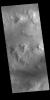 This image from NASA's Mars Odyssey shows Lyot Crater, a large, complex crater in the northern lowlands of Vastitas Borealis.