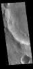 This image from NASA's Mars Odyssey shows a delta deposit that was created by the flow from the rim channel into the crater.