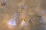 This image, taken on Nov. 30, 2010, by NASA's Mars Reconnaissance Orbiter, shows a Mars dust tower, a concentrated cloud of dust that can be lofted dozens of miles above the surface.