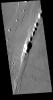 This image from NASA's Mars Odyssey shows part of Tractus Catena, just one of many north/south trending tectonic graben located south and east of Alba Mons.