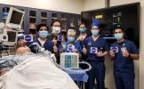 Doctors in the Department of Anesthesiology and the Human Simulation Lab at the Icahn School of Medicine at Mount Sinai in New York give a thumbs-up after testing a ventilator prototype developed by NASA's Jet Propulsion Laboratory.