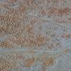 This image of Europa shows a region of blocky chaos terrain, where the surface has broken apart into many smaller chaos blocks that are surrounded by featureless matrix material.